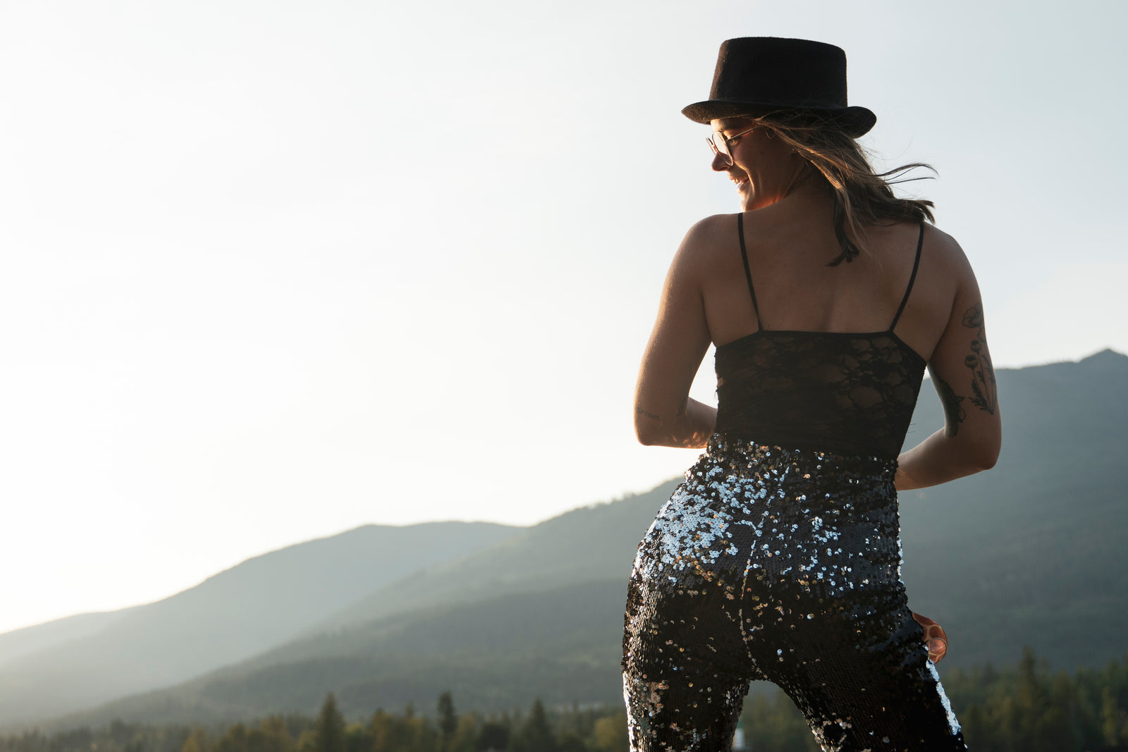 dancing girl wearing black and silver sequin flared trousers by Sparklebutt