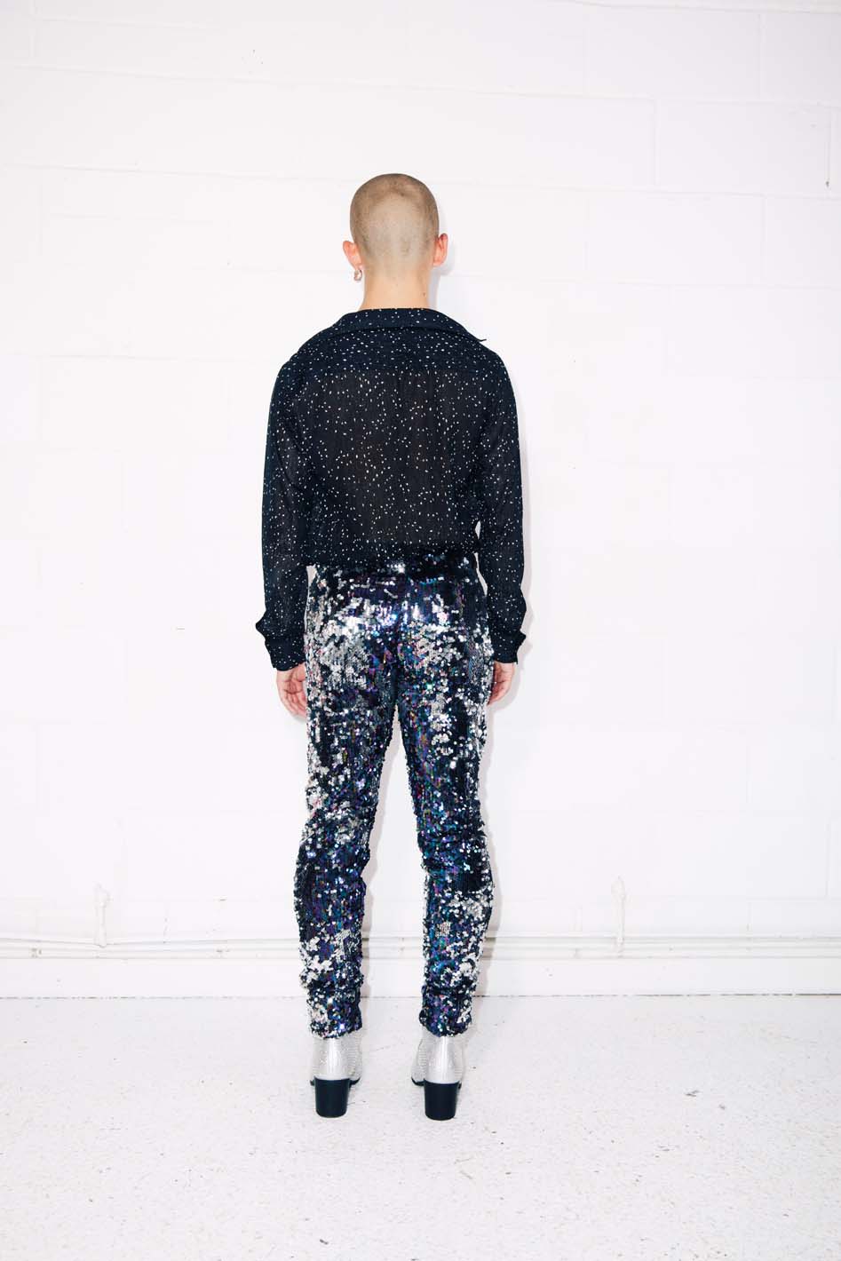 Man wearing blue silver sequin pants