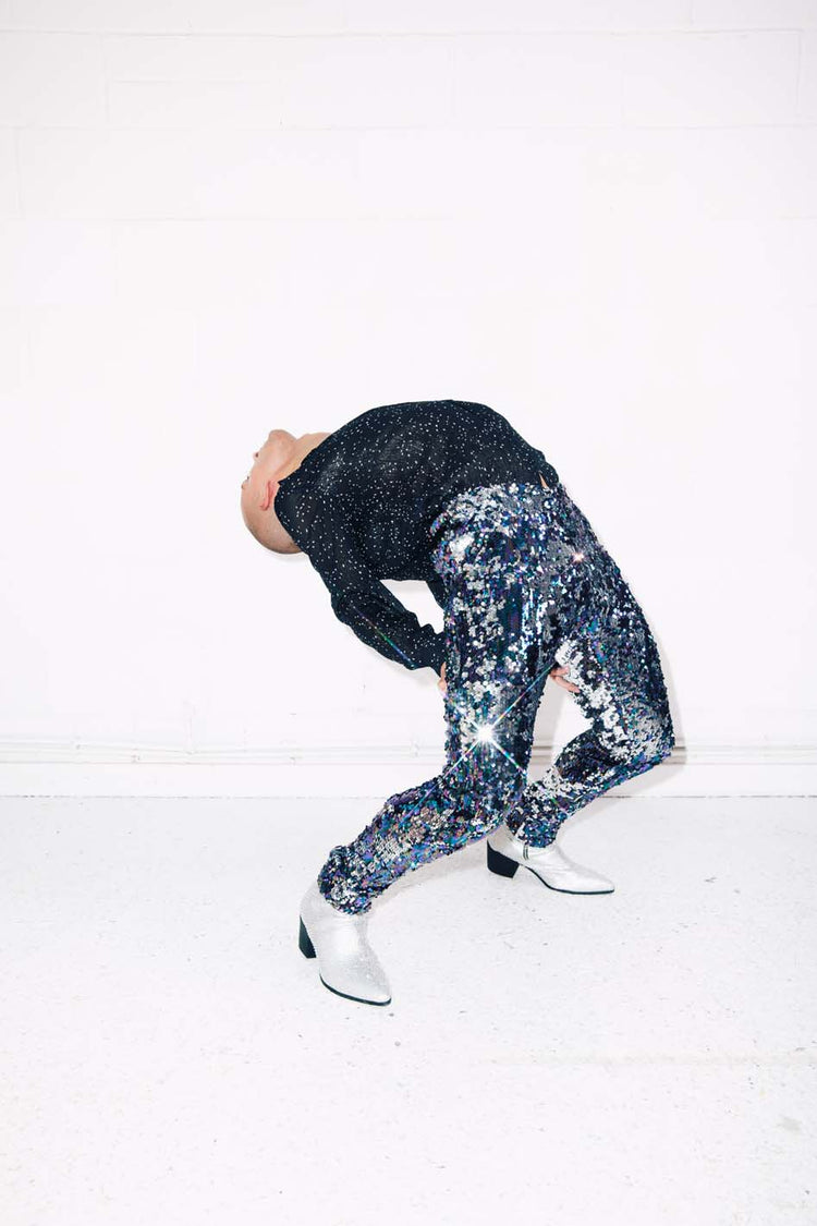 Man wearing blue silver sequin pants