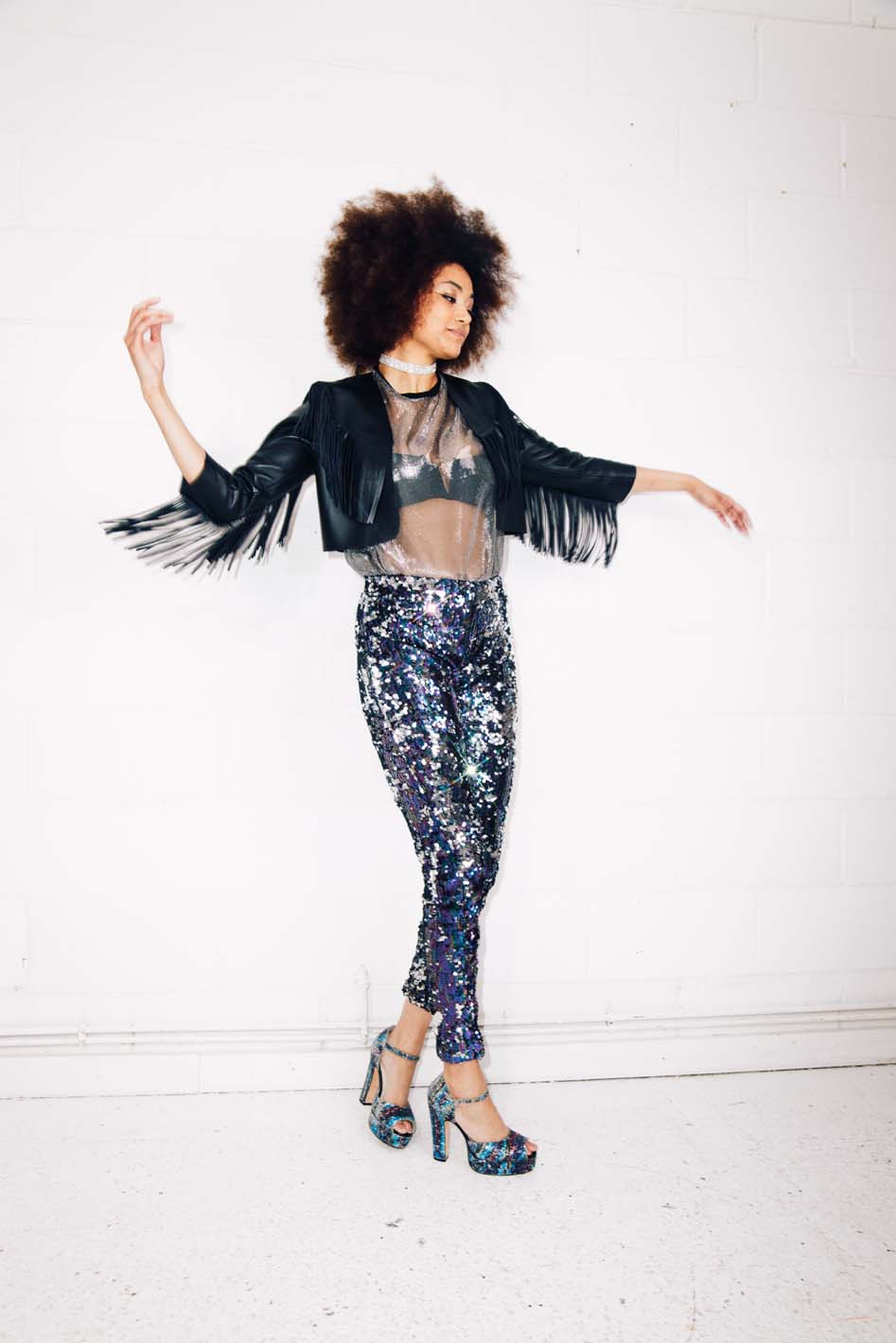 Woman wearing blue silver sequin pants