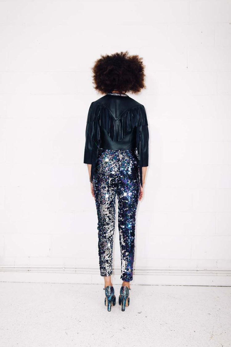 Woman wearing blue silver sequin pants