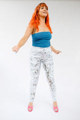 Woman wearing white silver sequin pants